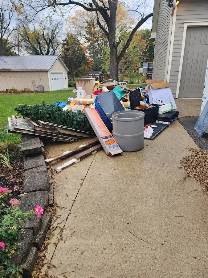 Dumpster being loaded with debris for 10 Yard Dumpster Rental in Westampton